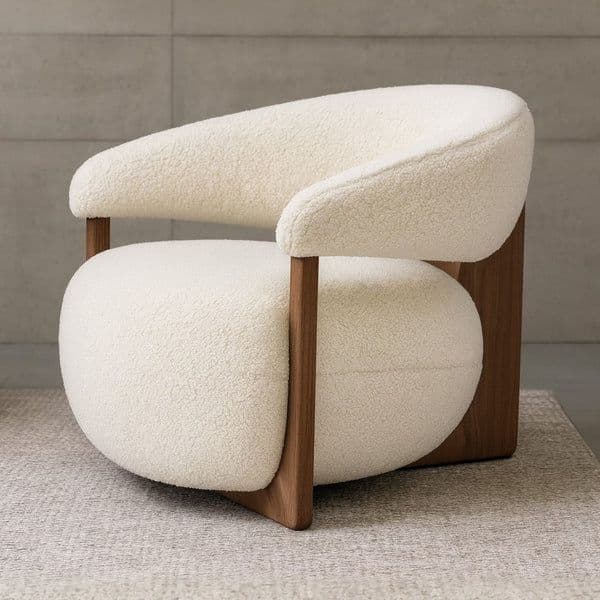 A cream-colored, heavily upholstered lounge chair featuring a distinct rounded silhouette, supported by an exposed dark wood frame that cradles the soft bouclé cushions. — 3D model