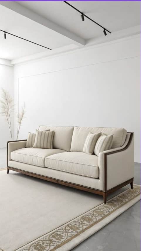 A long, rectangular sofa featuring a prominent exposed dark wood frame outlining the back and sloped… — 3D model