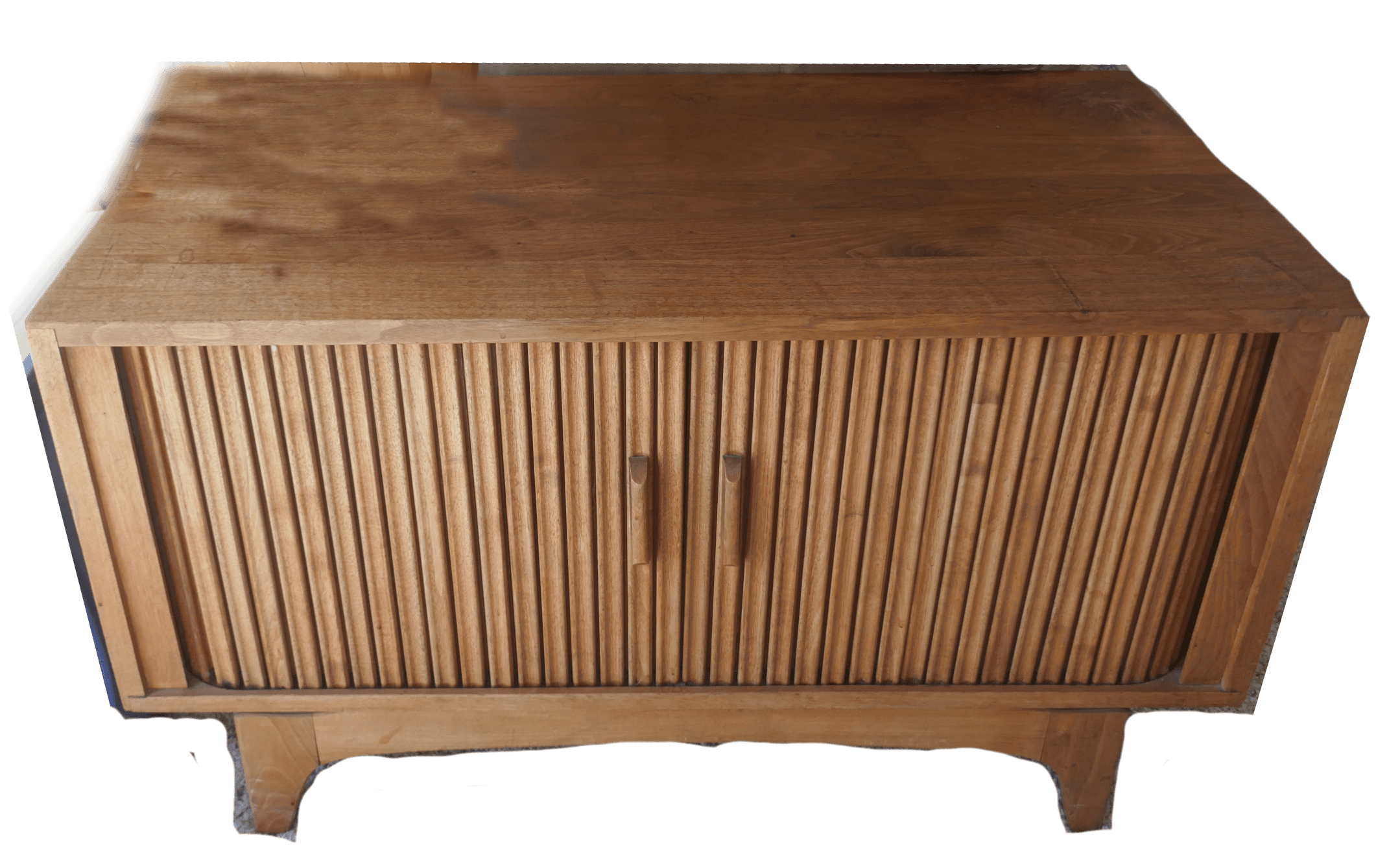 A rectangular, light-toned wood console cabinet featuring two horizontally slatted doors with integrated pull handles. The cabinet is elevated on splayed, tapered legs, giving it a distinct mid-century modern aesthetic. The wood grain is visible throughout the piece, suggesting solid wood construction or high-quality veneer. It is suitable for storage and display in various living spaces. — 3D model