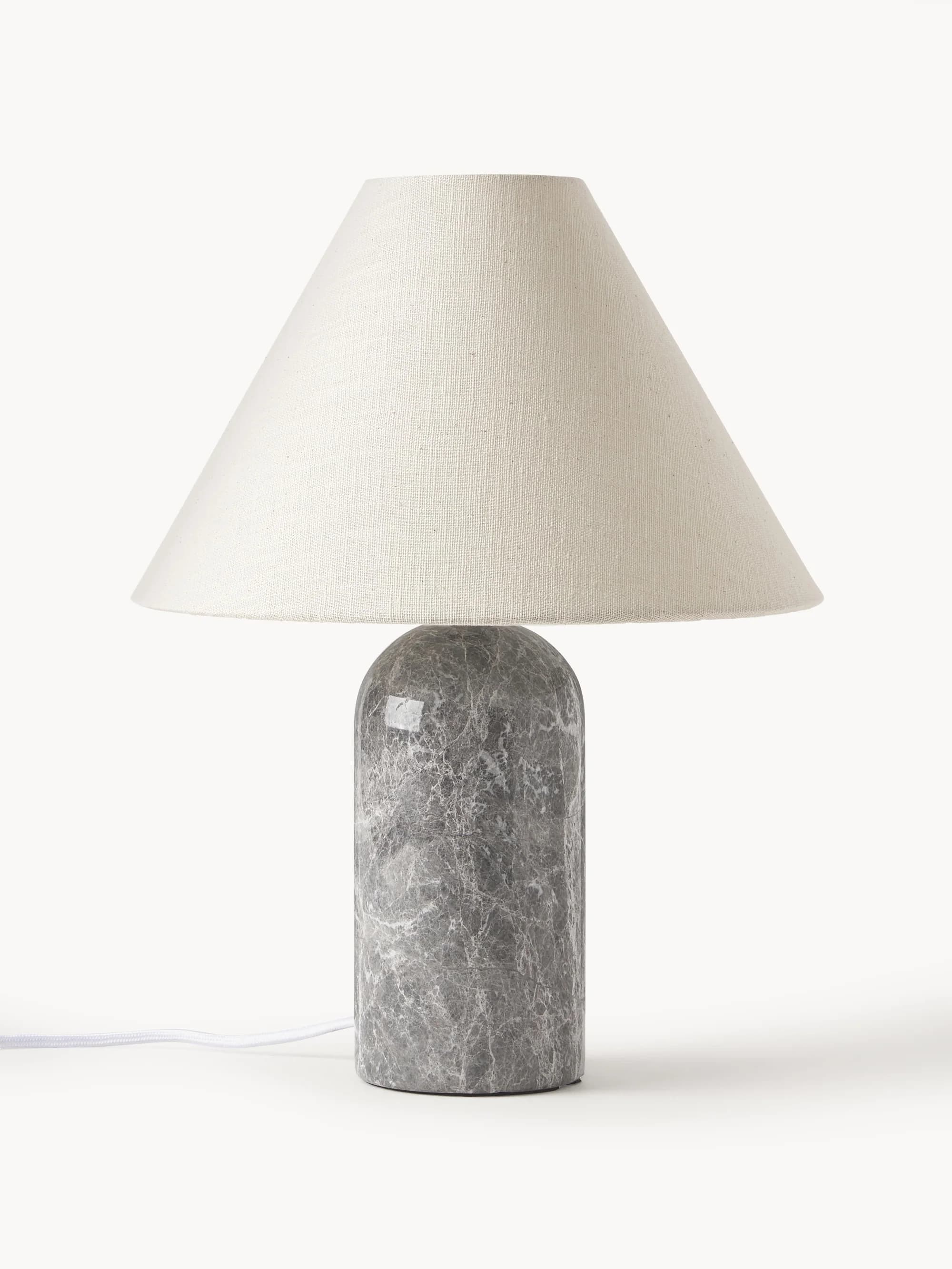 A modern table lamp featuring a cylindrical base constructed from grey marble with white veining, topped by a subtly rounded dome. It is paired with a conical off-white fabric lampshade, designed to diffuse light softly. — 3D model