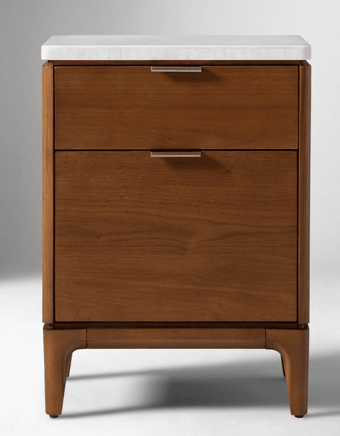 A wooden nightstand with a white top surface and two drawers. The nightstand features brass-colored… — 3D model