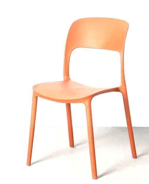 A modern, molded plastic chair with a curved seat and backrest, supported by four tapered legs. The backrest features a cutout opening. — 3D model