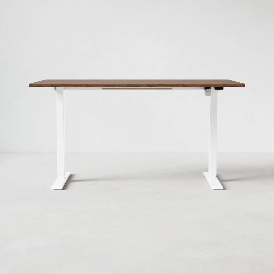 A modern standing desk with a rectangular, wood-grain finished top and white, adjustable legs. The l… — 3D model