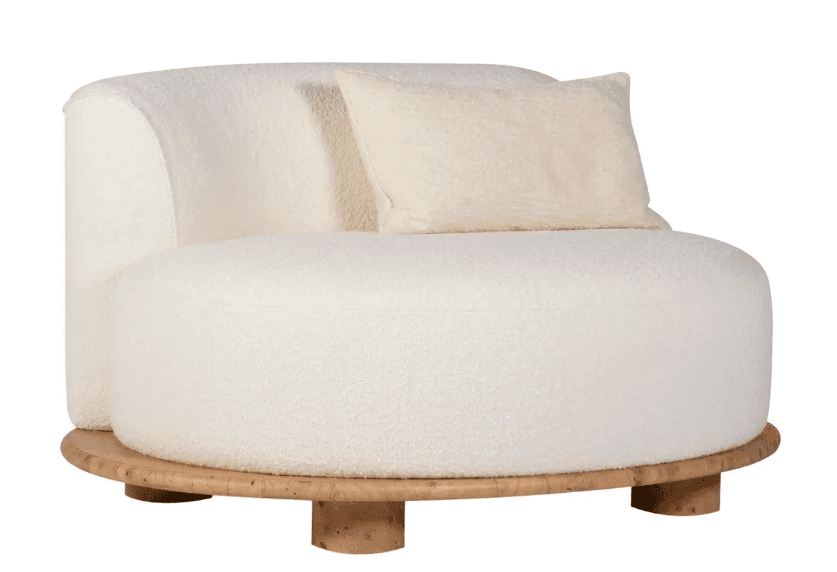 A modern armchair with a rounded silhouette, upholstered in a textured, off-white boucle fabric. It… — 3D model