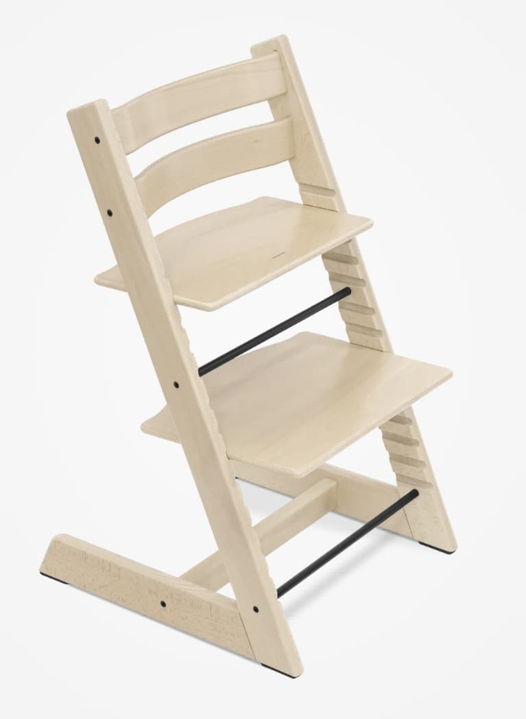 A modern wooden high chair with an adjustable seat and footrest, featuring a natural wood finish and black metal accents. — 3D model