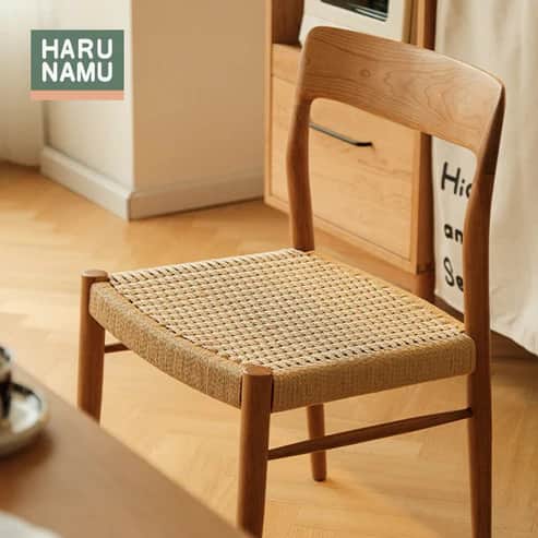 An armless dining chair constructed from light-toned natural wood, featuring a curved backrest and a… — free GLB 3D model