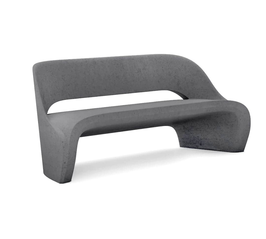A modern, dark gray, monolithic bench made of concrete, featuring a continuous, curved form that int… — 3D model