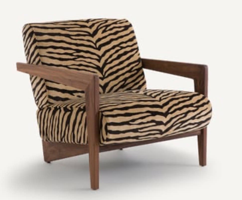 An upholstered lounge chair featuring a striking black and beige zebra print fabric and an exposed dark wood frame with open armrests. — 3D model