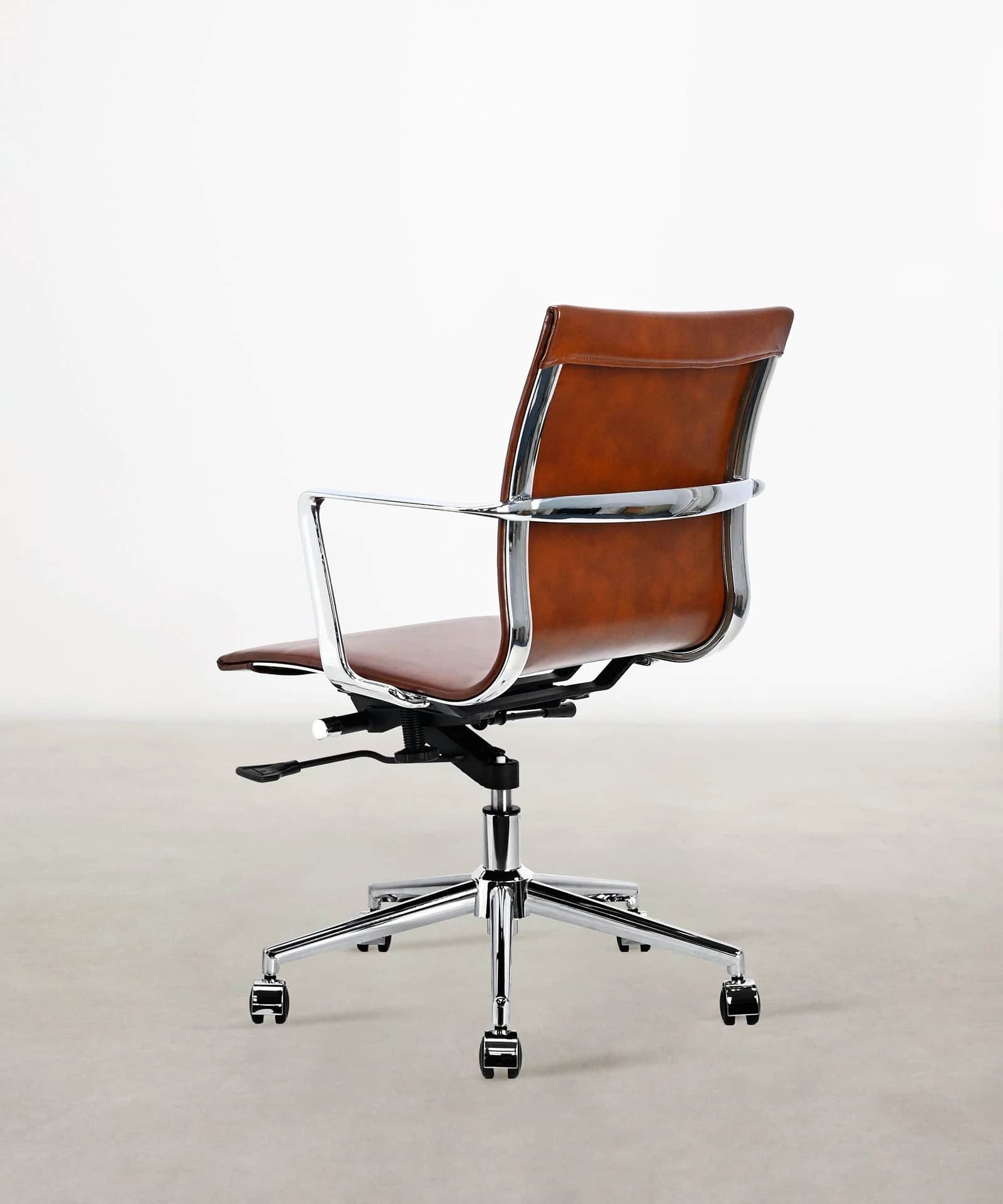A stylish mid-century modern-inspired office chair featuring brown leather upholstery, a polished ch… — 3D model