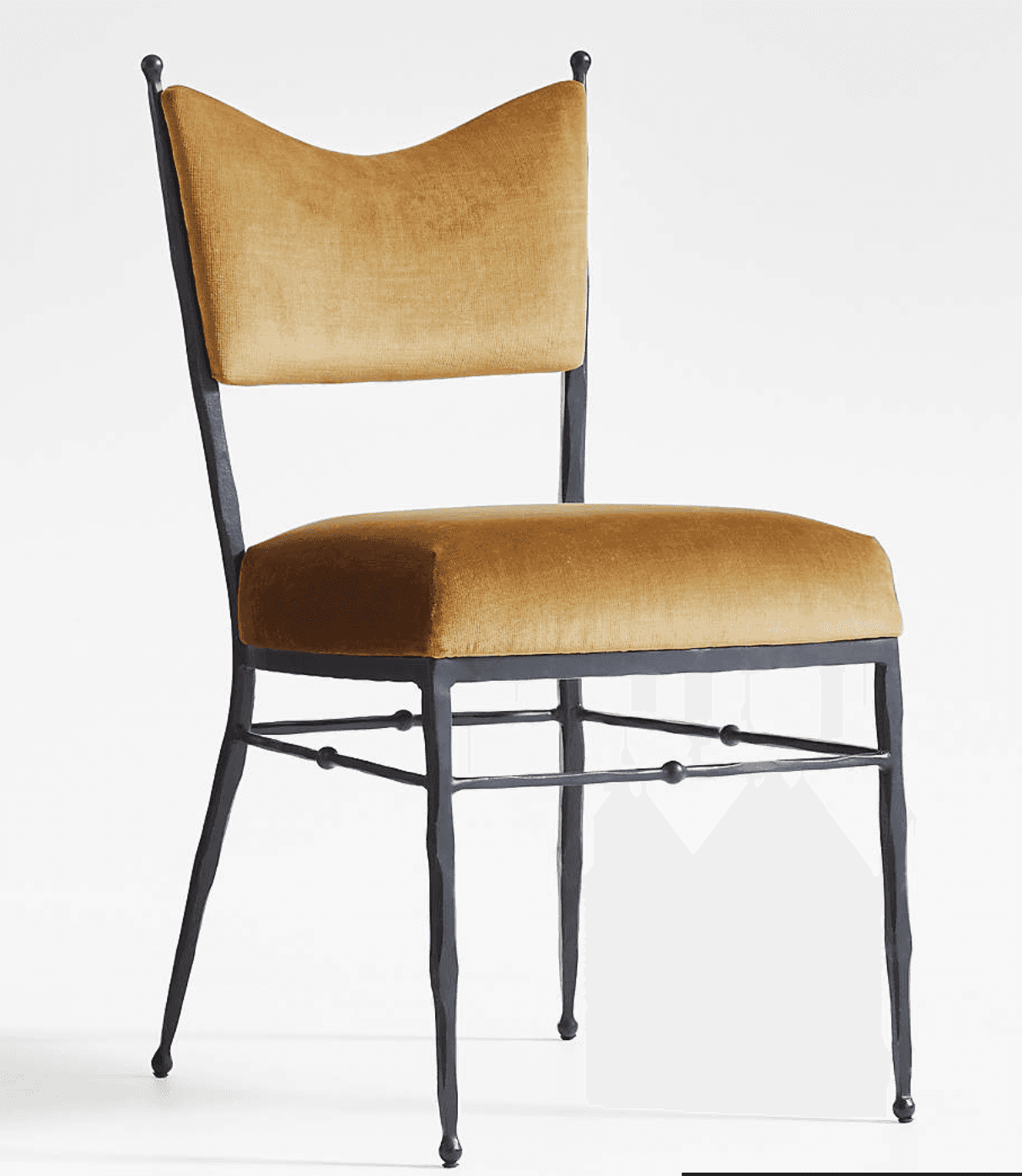 An upholstered dining chair with a dark-finished forged iron frame and gold velvet upholstery, featu… — 3D model