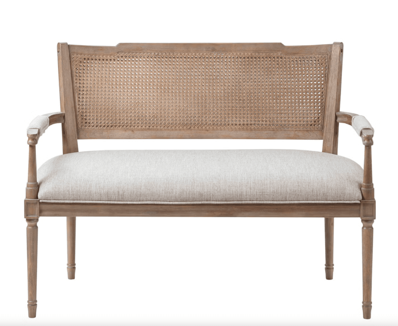 A French Country style settee or bench crafted from distressed light-toned wood, featuring a woven cane backrest, and an upholstered seat cushion in a light neutral fabric. It includes carved armrests and tapered legs. — 3D model