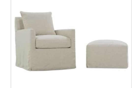 An upholstered armchair featuring a full, floor-length skirted base and a neutral-toned fabric. It h… — free BLEND 3D model