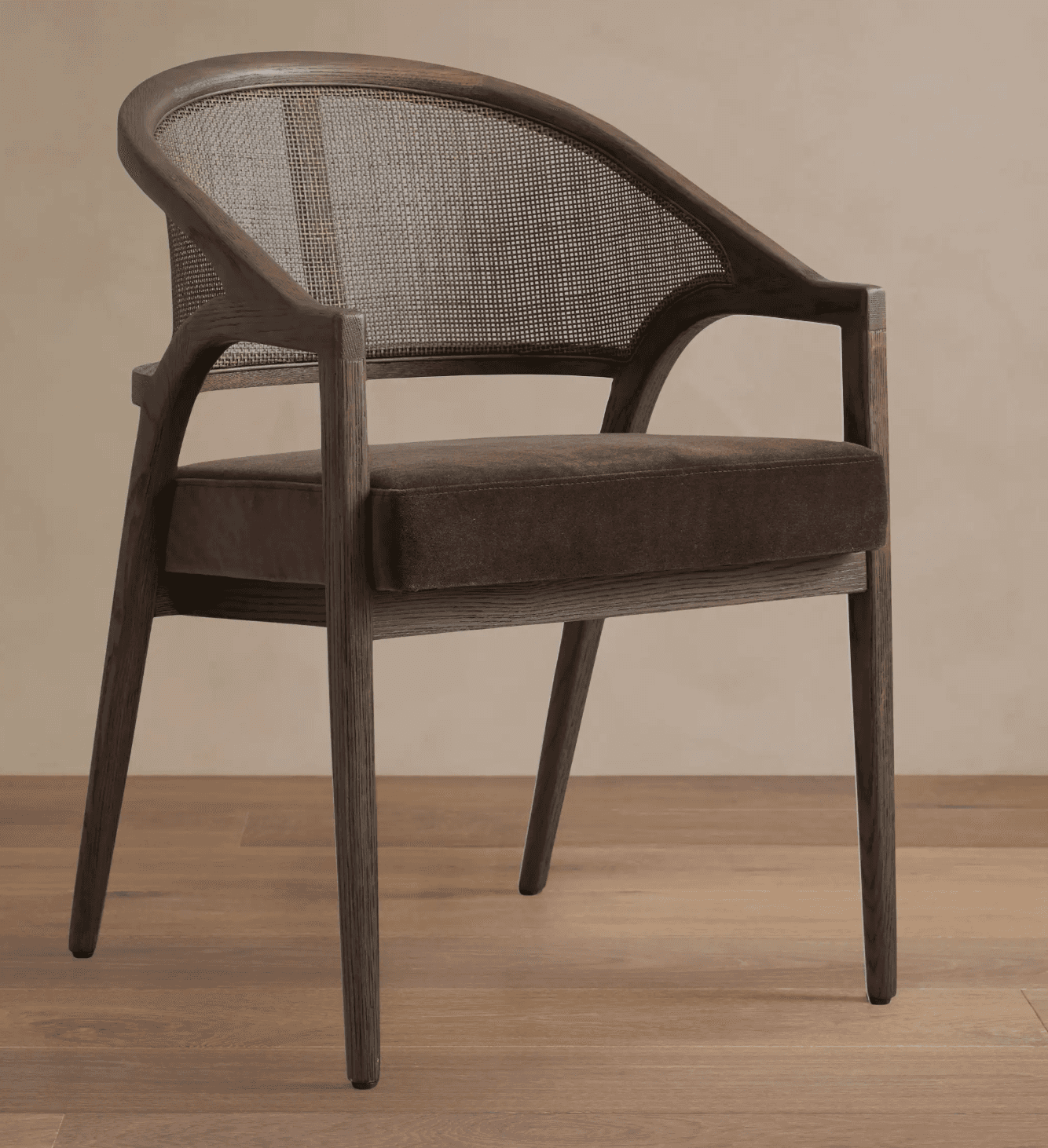 A wooden armchair with a cane back and upholstered seat. The chair features a curved backrest and ar… — 3D model