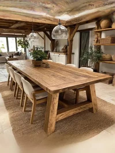 A rectangular solid wood coffee table with a light oak finish. It features a trestle-style base with two A-frame supports connected by a central stretcher. The tabletop has a framed or paneled design, indicating solid wood construction or a veneer with a solid wood edge. — 3D model