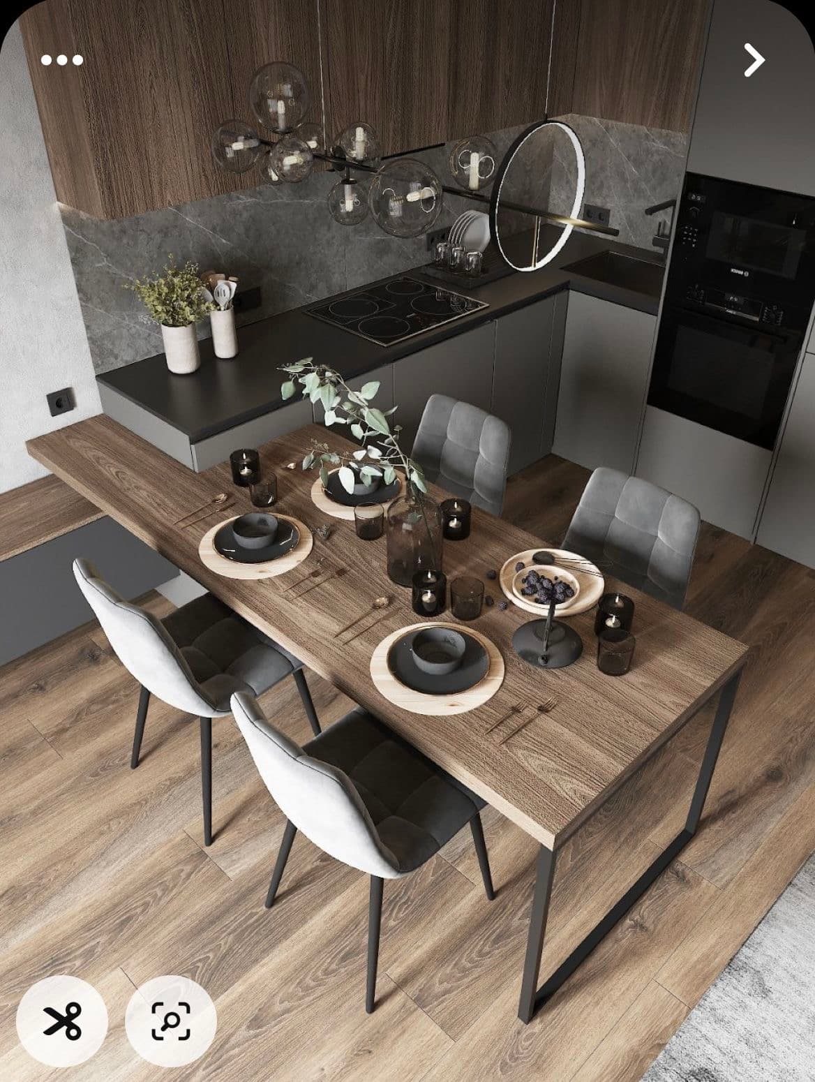A rectangular dining table featuring a light brown wood-grain tabletop supported by two U-shaped black metal legs. The table is set with placemats, dark dishes, and decorative elements including a vase with greenery. — 3D model
