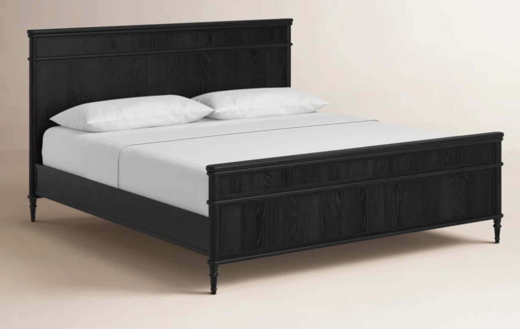 A black wooden bed frame with a headboard and footboard. The headboard has a rectangular top rail with two horizontal inset panels below. The footboard has a similar design with a horizontal top rail and two inset panels. The frame rests on four turned legs. Two white pillows and white bedding are on the mattress. — 3D model