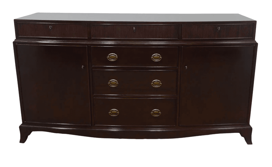 A traditional Georgian style sideboard crafted from dark-stained mahogany wood, featuring a distinctive serpentine or bowed front. It includes three reeded-front drawers with key escutcheons across the top, three central drawers with ornate brass ring pull handles, and two flanking cabinet doors with key escutcheons. The piece is supported by short, integrated bracket feet. — 3D model