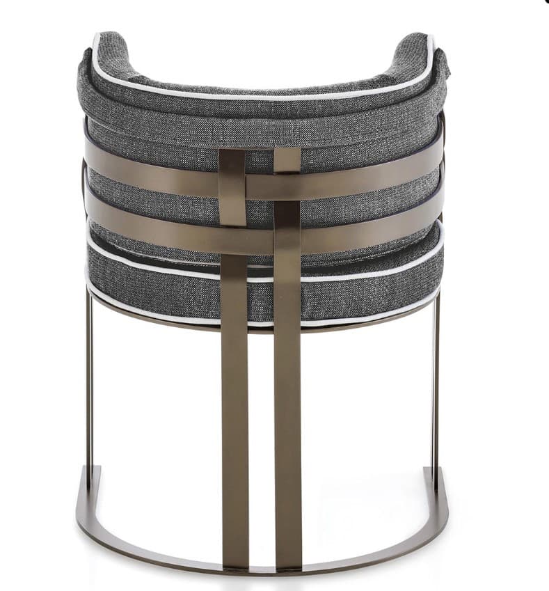A modern accent chair with a curved backrest and a metal frame. The seat and back are upholstered in a textured grey fabric with white piping. The frame consists of two curved legs and vertical supports that intertwine at the back. The metal has a brushed bronze or antique brass finish. — 3D model