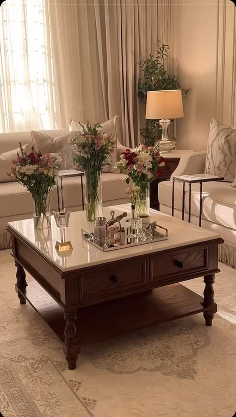 A square, traditional style coffee table featuring a dark wood frame, a white marble slab top, two functional drawers, and a lower display shelf. The table is supported by four turned legs. — 3D model