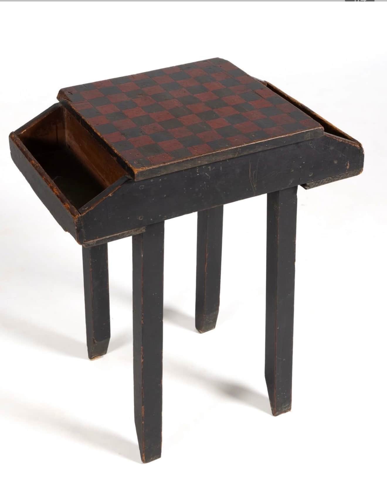 A small, rectangular wooden table featuring a hand-painted checkerboard top in black and reddish-bro… — 3D model