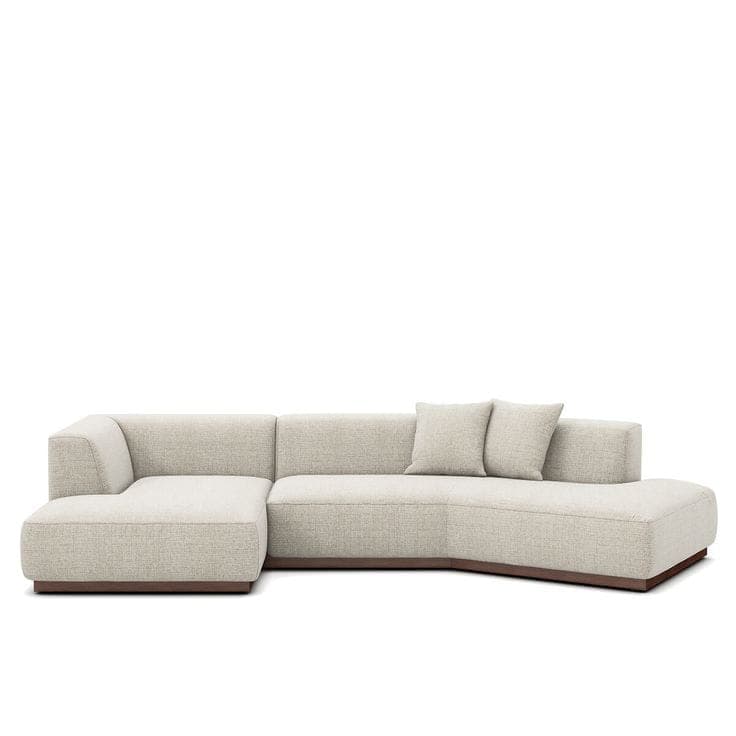 An L-shaped sectional sofa featuring a modular design with light beige textured fabric upholstery and a dark wood plinth base. The configuration includes a left-arm section, a central armless section, and a right-facing chaise lounge with a gentle curve. It is furnished with matching loose back cushions. — 3D model