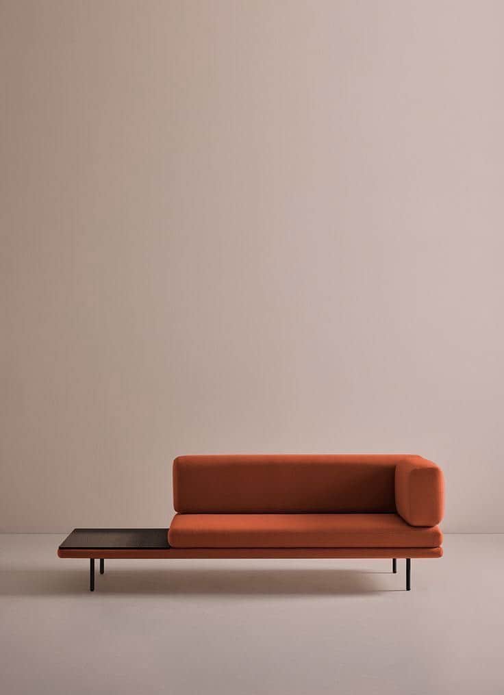 A modern chaise lounge featuring vibrant orange fabric upholstery, an integrated dark wood side tabl… — 3D model