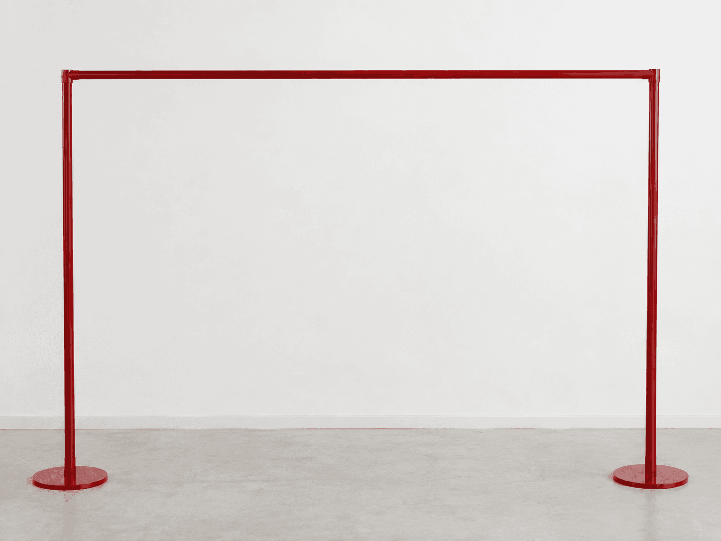 A minimalist, freestanding garment rack made from red-painted metal, featuring two vertical poles wi… — 3D model
