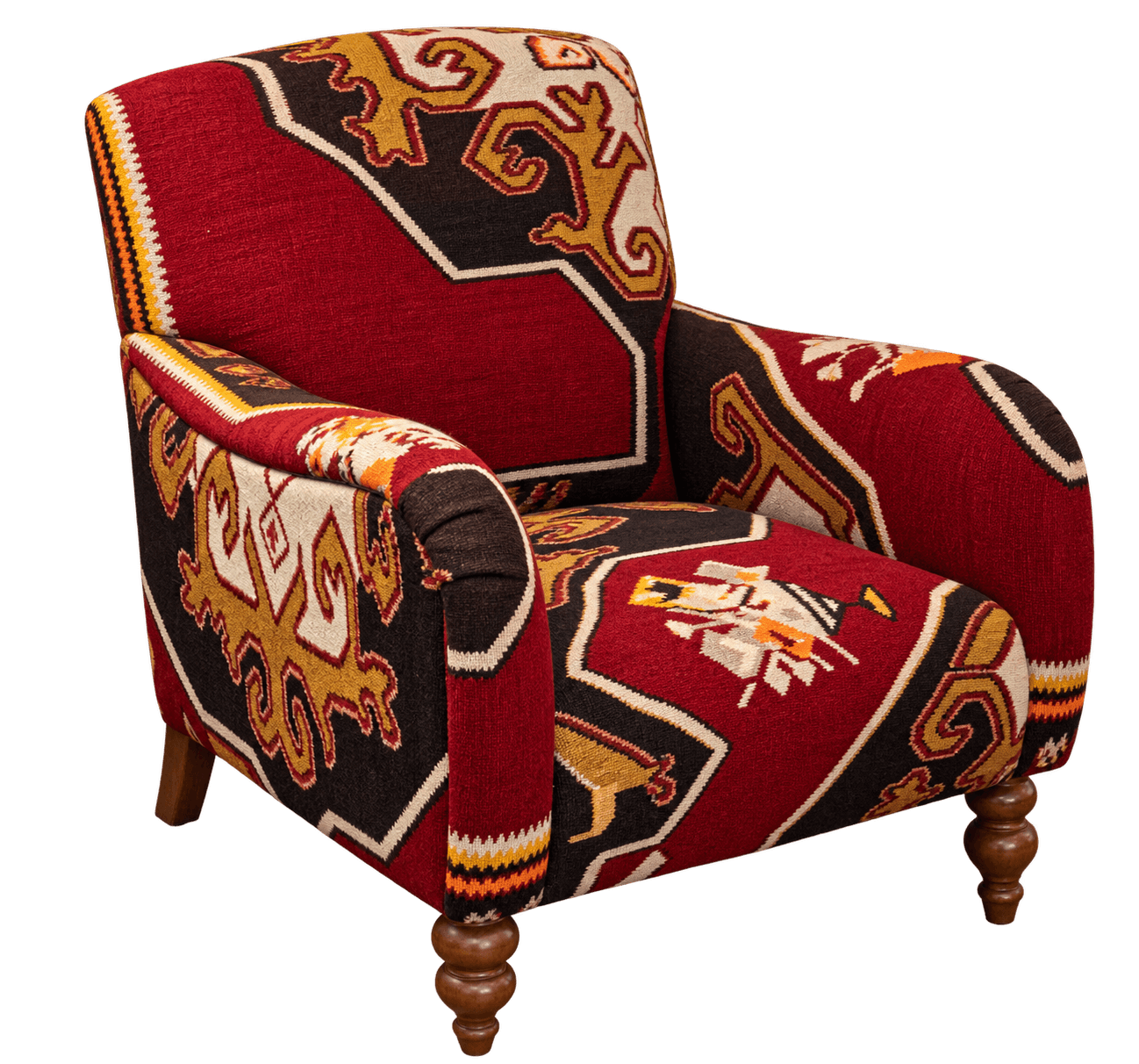An upholstered armchair featuring a distinctive Kilim-style geometric pattern across its entire surface. The chair has a traditional club chair silhouette with rolled arms and a relatively compact form. It is supported by four wooden legs, with the front two being ornately turned and the rear two appearing more tapered and straight. The fabric displays a vibrant color palette of deep red, black, gold/ochre, and cream, with accents of orange and white, forming intricate interlocking motifs and borders. The upholstery covers all visible parts of the frame, including the back, seat, and arms, creating a cohesive and bold design statement. — 3D model