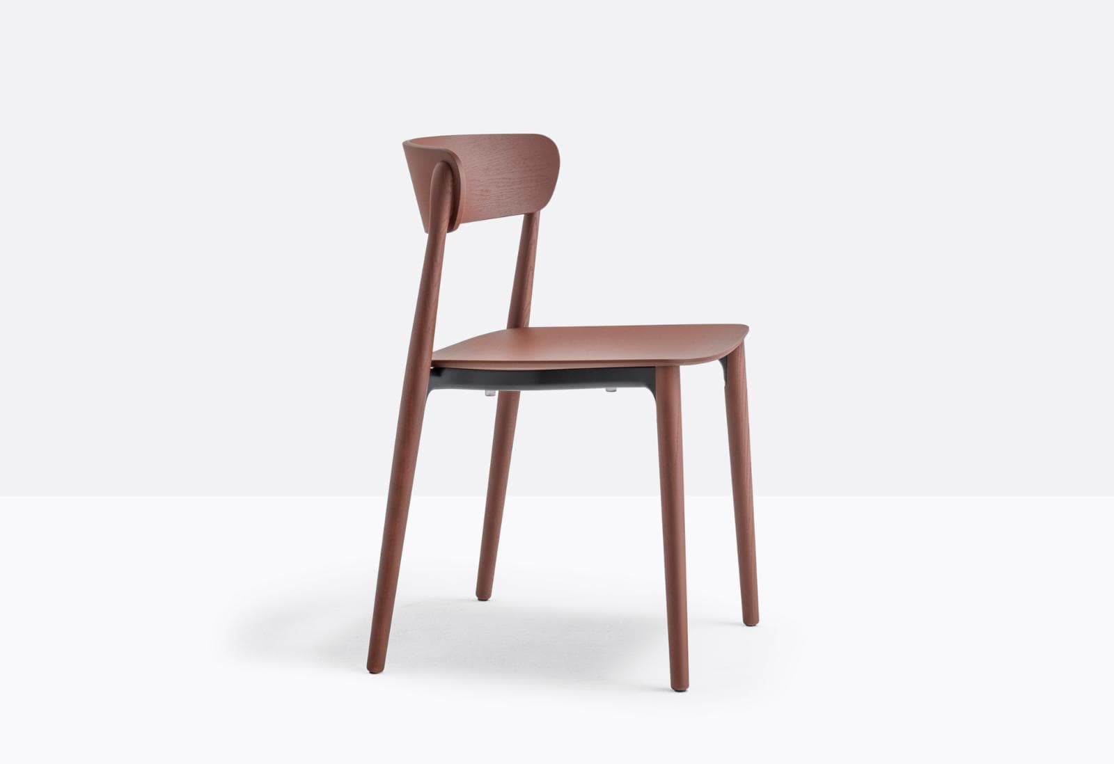 A modern dining chair with a wooden-like finish. It features a curved backrest that smoothly transitions into the rear legs. The seat is flat and appears to be made of a different material, possibly plastic or metal, with a dark finish. The front legs are straight and slightly angled outwards. The overall design is minimalist and contemporary. — 3D model