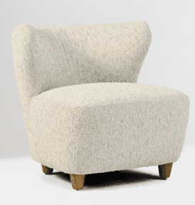 A cream-colored, textured armchair with a high, curved back and sloping arms. It features four short, tapered wooden legs. The upholstery appears to be a boucle or similar textured fabric. — 3D model