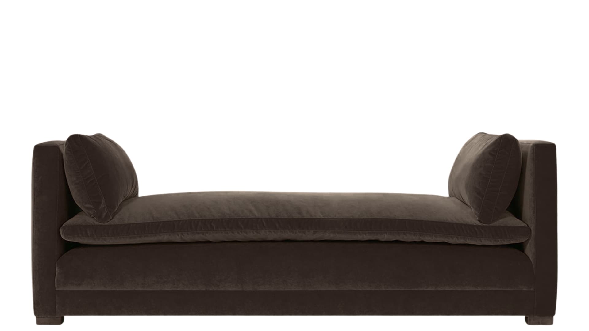 A low-profile upholstered daybed with a rectangular seat cushion and two scatter cushions placed against the high, padded armrests. The daybed features a continuous upholstered base and appears to be covered in a soft velvet fabric. — 3D model