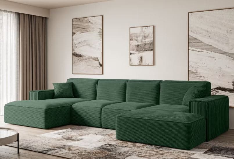A modular green sectional sofa with a chaise lounge on the left side and an ottoman extension on the right. The sofa features a corduroy-like texture on its upholstery and appears to be constructed from multiple connected units, allowing for various configurations. It includes a single armrest on the left end and a pillow on the left side. — 3D model