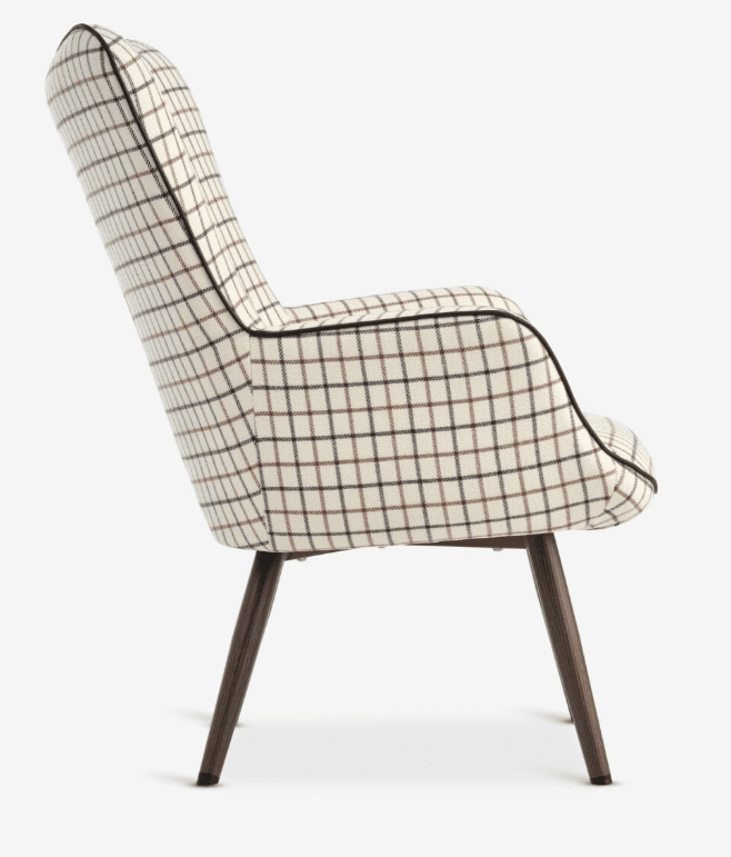An armchair with a high, curved back and integrated armrests, upholstered in a fabric with a plaid pattern. The chair features four tapered wooden legs with protective caps at the base. — 3D model