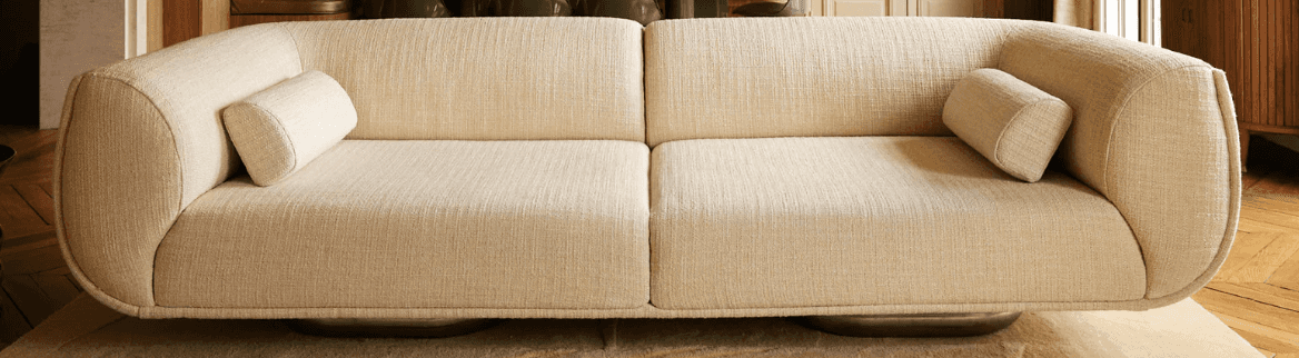 A modern, two-seater sofa with rounded edges and a low profile. The sofa features a single seat cush… — free GLTF 3D model