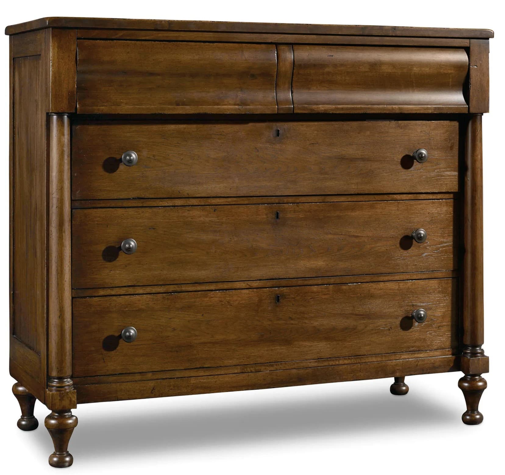 A four-drawer chest of drawers with a carved top drawer facade. It features turned legs and metal drawer pulls, with visible keyholes on each drawer. — 3D model