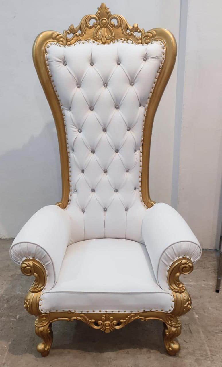 A highly ornate, white and gold chair featuring an exceptionally tall, tufted back with crystal butt… — free STL 3D model