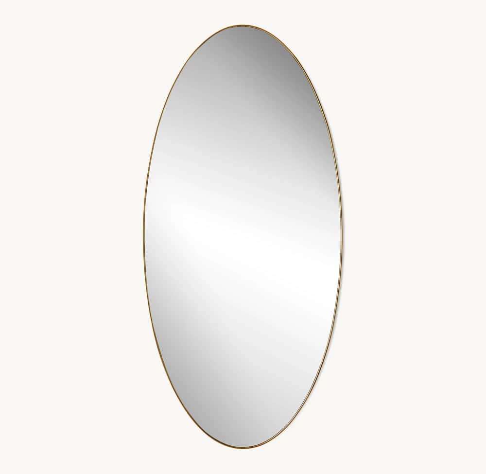 An oval-shaped wall mirror featuring a very thin, polished brass frame. The mirror surface is clear… — 3D model