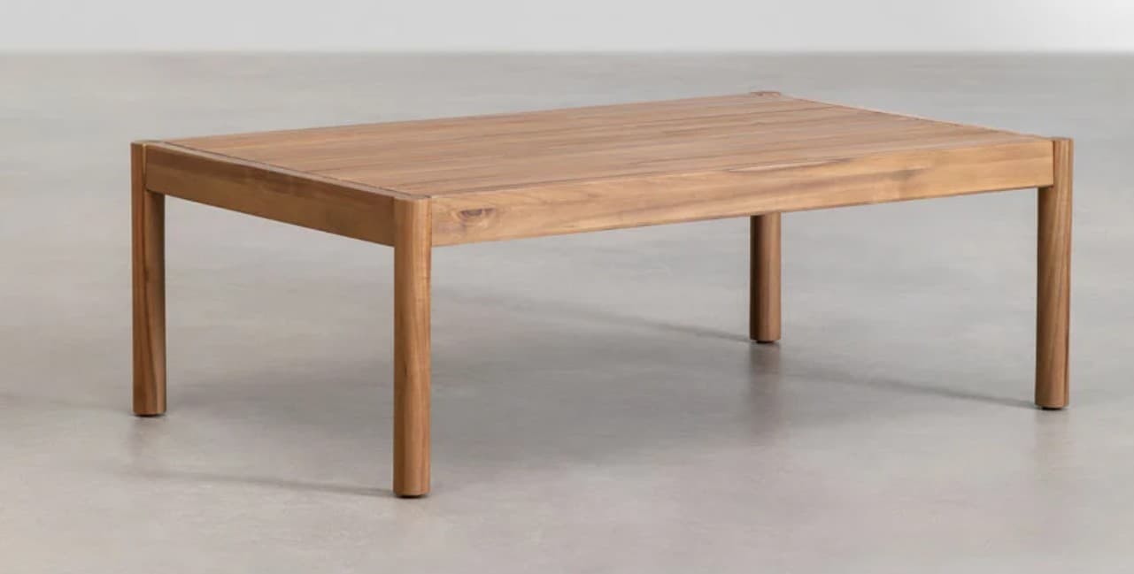 A rectangular coffee table constructed from wood. It features a flat top with a slight inward curve along the longer edges and four straight, cylindrical legs that extend from the corners of the base frame. The wood grain is visible, suggesting a natural finish. — 3D model