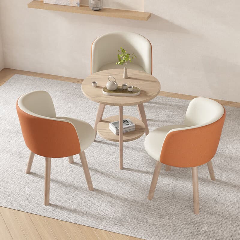 A light-colored wooden side table featuring a round top surface and a smaller, round lower shelf for additional storage or display. The table is supported by three splayed legs, creating a stable and visually appealing structure. The wood grain is visible, indicating a natural finish. — 3D model