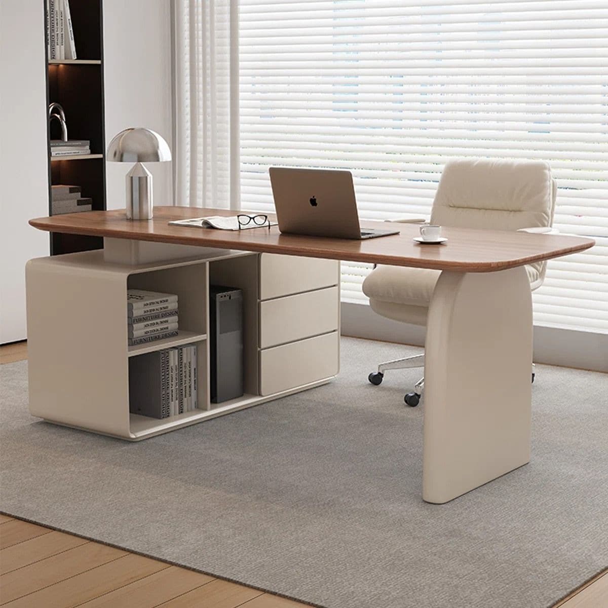 A modern executive desk featuring a light wood or wood veneer tabletop with rounded corners, supported by an asymmetrical base. One side incorporates an integrated storage unit with open shelving and closed drawers in a matte beige finish, while the other side is supported by a single, curved panel leg in the same beige hue. — 3D model