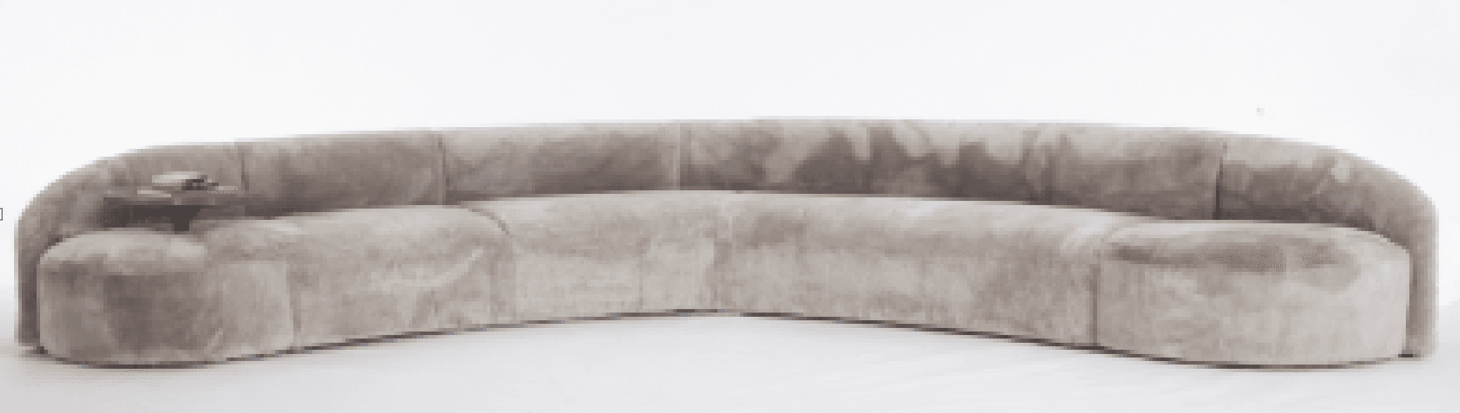 A long, curved sofa with a plush, textured upholstery. The sofa features a continuous, rounded backr… — free GLTF 3D model