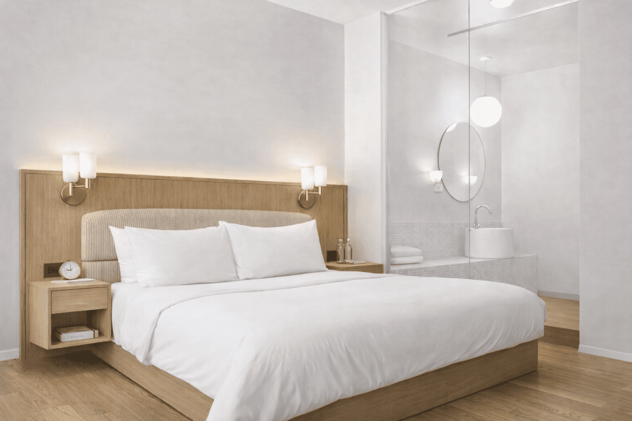 A modern hotel-style bed with a light wooden headboard and frame. The bed features two white pillows… — free OBJ 3D model