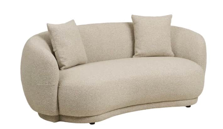 A two-seater sofa with a curved silhouette, upholstered in a textured boucle fabric. It features rou… — free GLTF 3D model