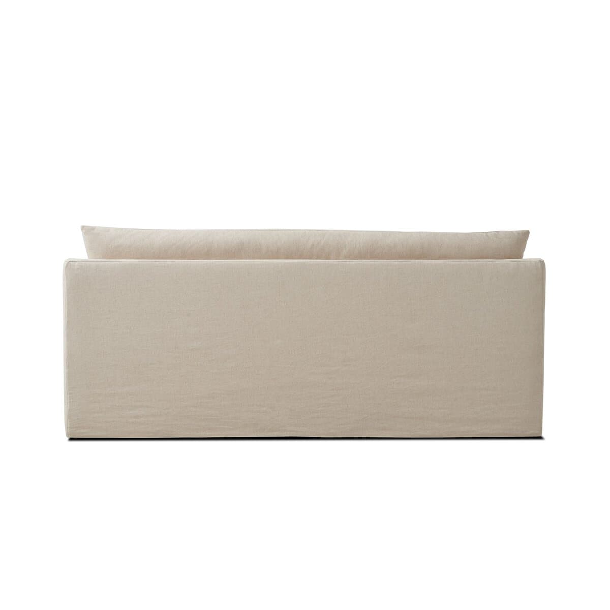 A sofa viewed from the back. It features a simple, modern design with clean lines. The sofa has a low profile and is upholstered in a textured, light-colored fabric. — 3D model