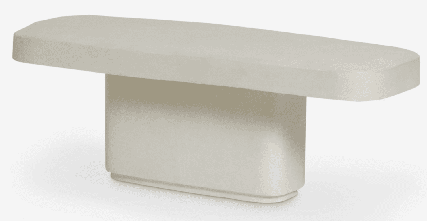 A minimalist, low-profile console bench featuring a rectangular seat with rounded edges, supported by a single, central rectangular block. The bench is presented in a uniform off-white color with a smooth, matte plaster-like finish. — 3D model