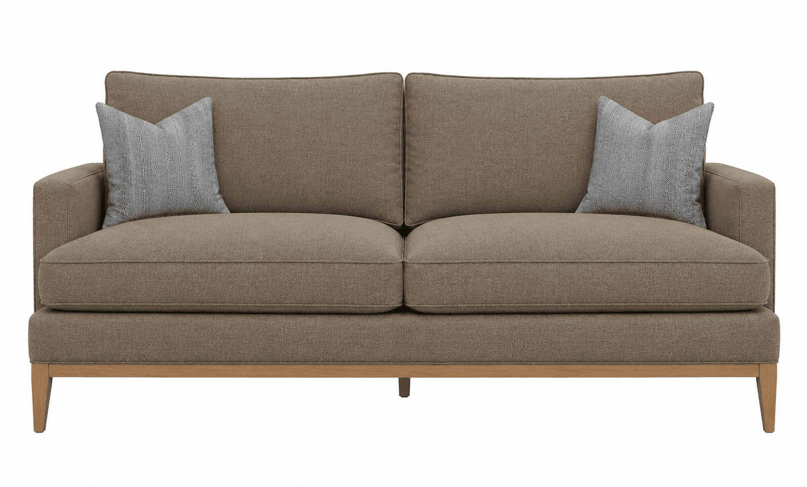 A contemporary two-seater sofa upholstered in a light brown, subtly textured fabric. It features a clean-lined silhouette with block arms and an exposed light wood frame base, including tapered legs. The sofa is furnished with two removable seat cushions and two back cushions, complemented by two light grey patterned throw pillows. — 3D model