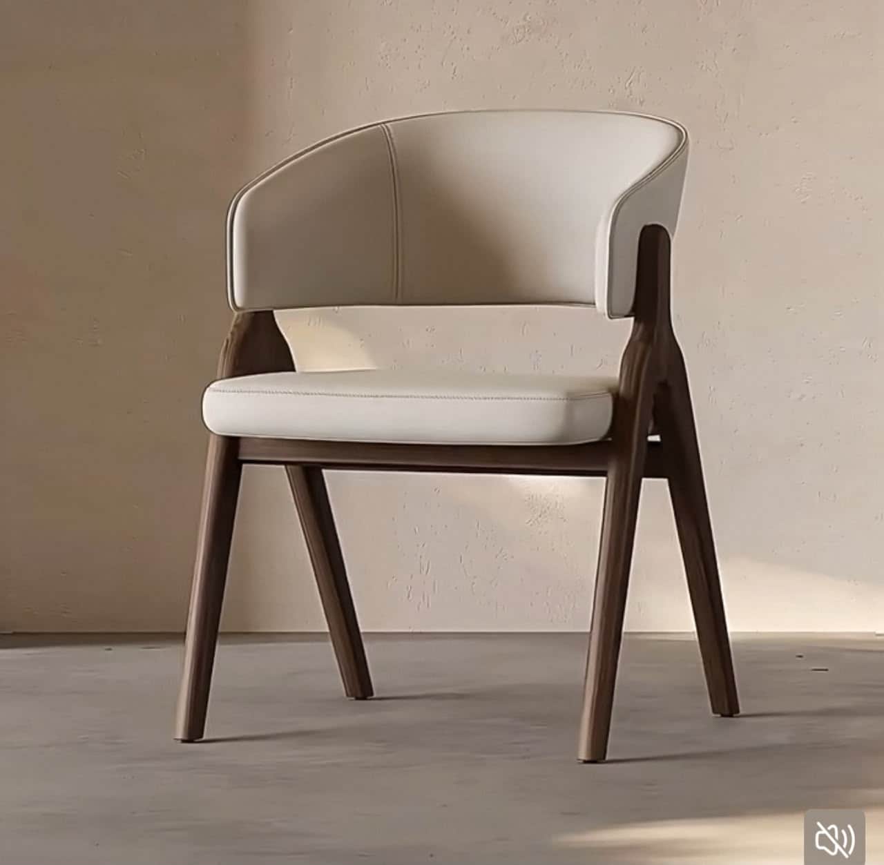 A modern armchair featuring a dark wood frame with slender, tapered legs and a light-colored upholst… — 3D model