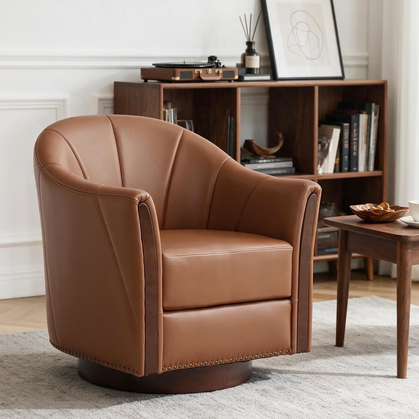 A stylish Art Deco style swivel barrel armchair, upholstered in a rich brown leather. The chair features a distinctive rounded, bucket-like silhouette with a fan-pleated backrest, offering a luxurious and comfortable seating experience. Integrated dark wood panels adorn the exterior sides and base, contrasting with the leather and adding a touch of classic elegance. A brass nailhead trim outlines the lower perimeter of the chair above its circular swivel base. — 3D model