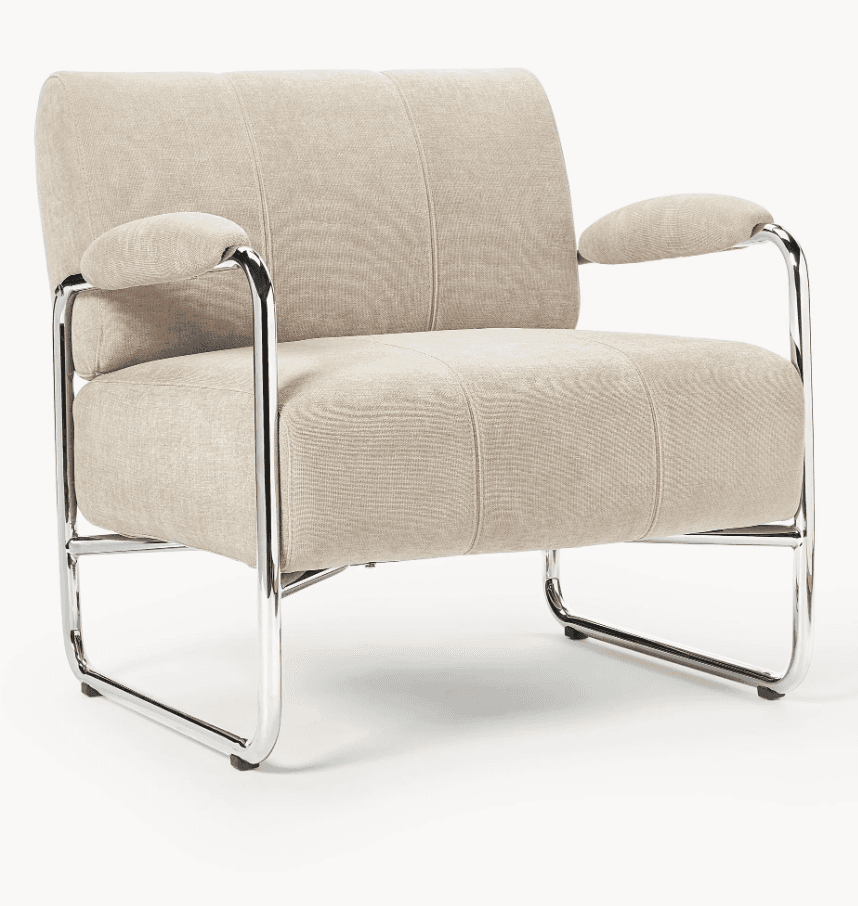 A modern lounge chair featuring a sturdy tubular chrome frame and plush beige fabric upholstery. The seat, backrest, and armrests are well-padded, with the back and seat cushions exhibiting subtle channel tufting. The chair has a minimalist yet comfortable aesthetic, supported by a continuous chrome frame that forms the legs, arms, and back support. — 3D model