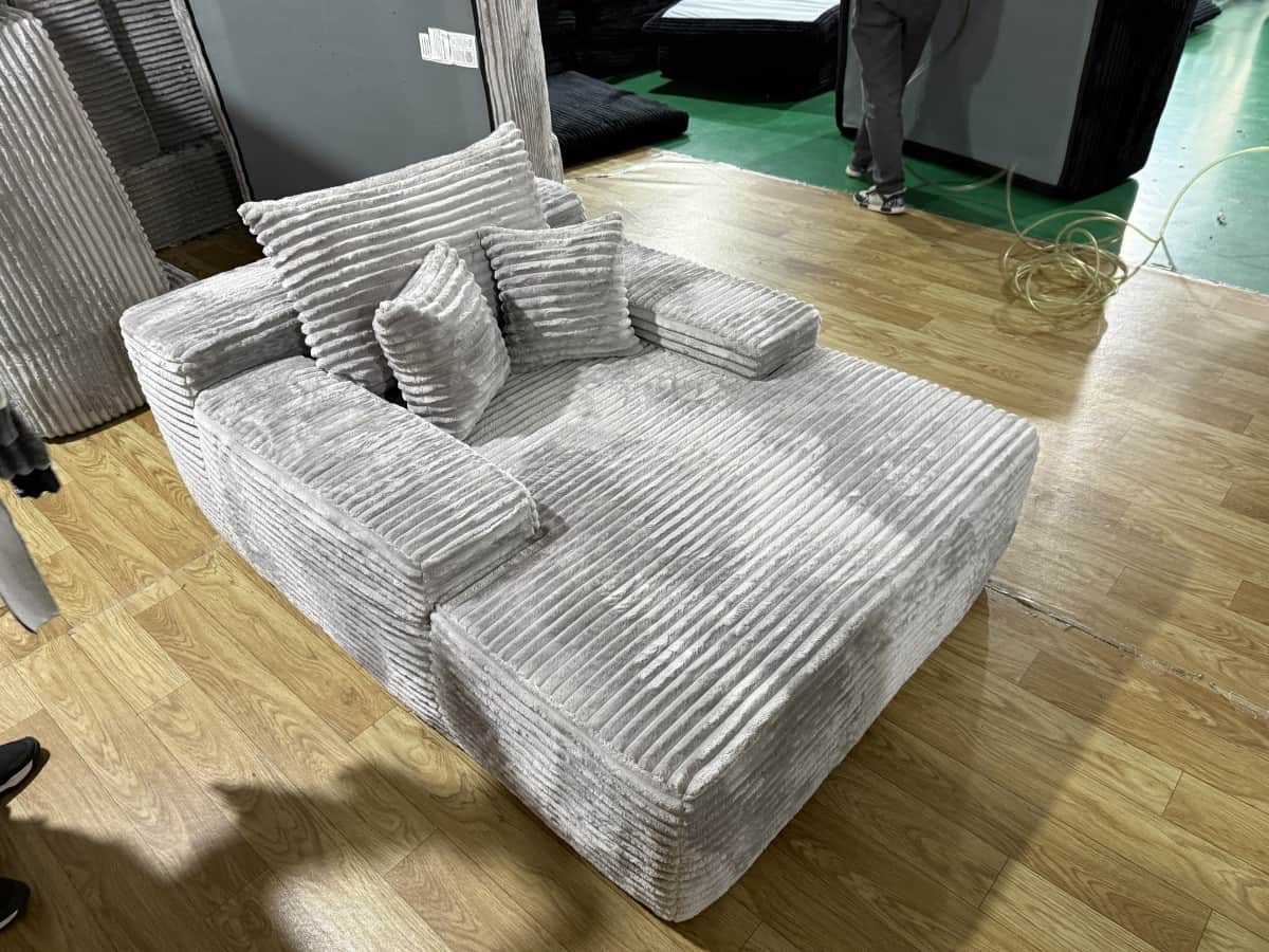 A modular sectional sofa with a low profile and a contemporary design. The sofa features a ribbed co… — 3D model